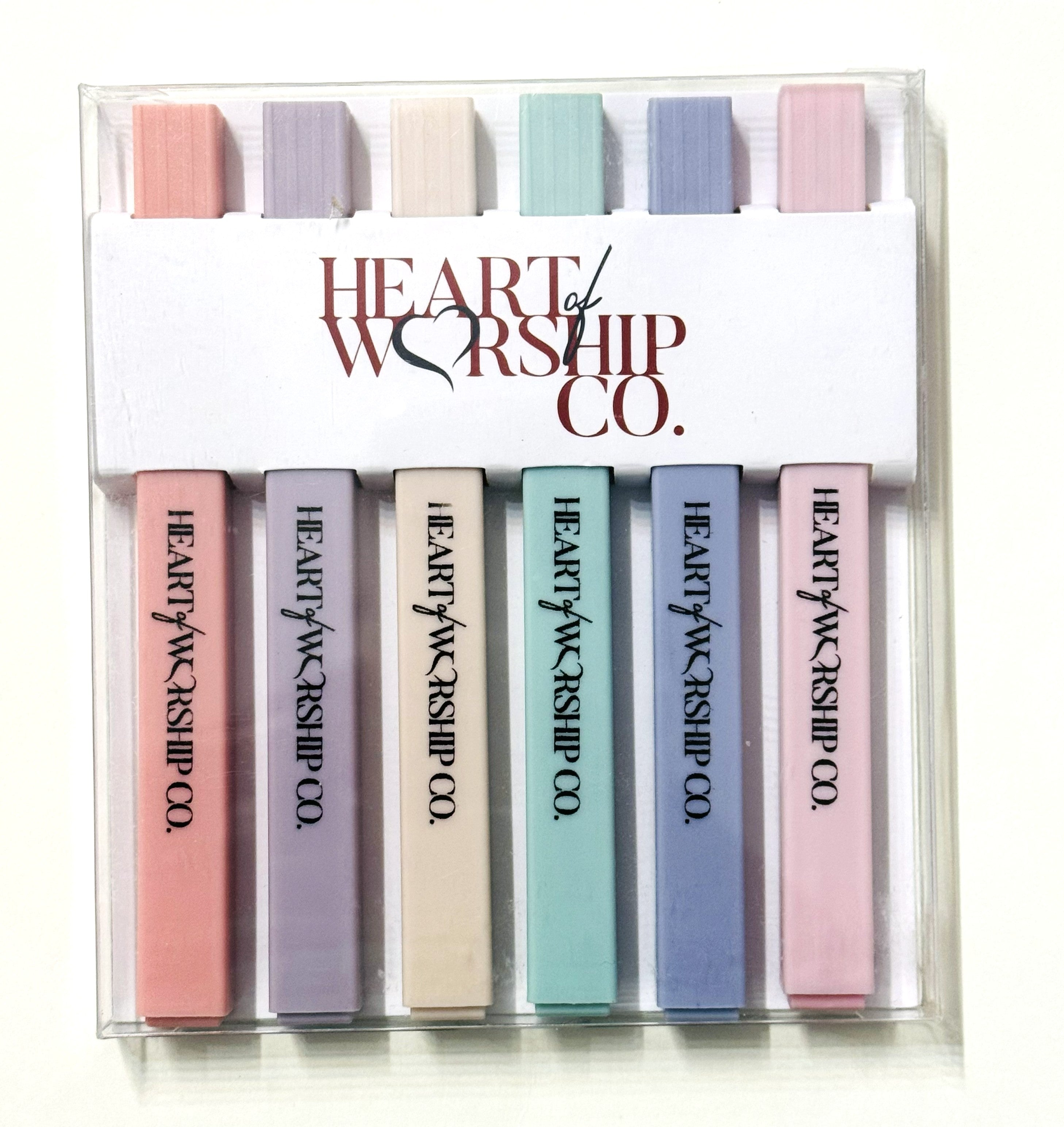 Set of pastel-colored markers with 'Heart of Worship Co.' branding in a clear plastic case.